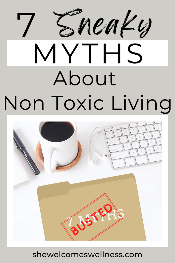 Pinterest pin; flat lay desktop, coffee, keyboard, pen, file folder with text: 7 Non Toxic Living Myths 'Busted'