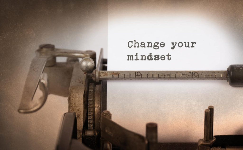 vintage typewriter and paper, typewritten words: Change your mindset