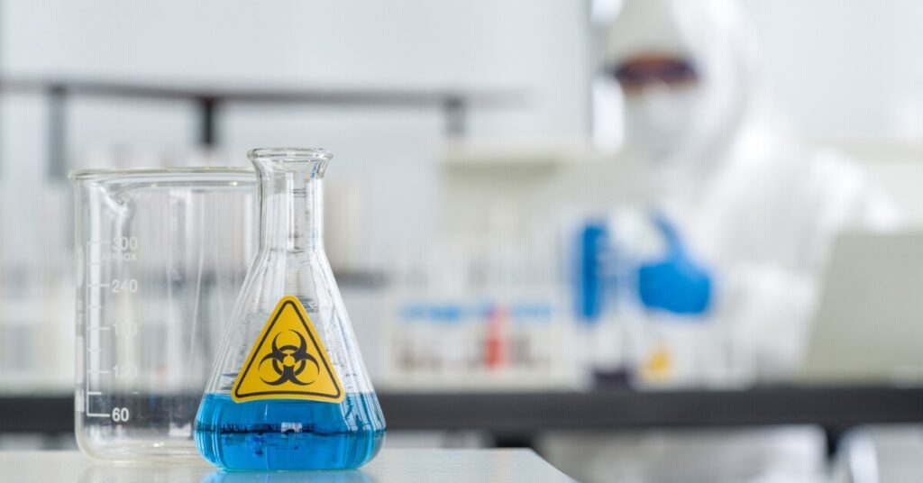 person working with hazardous chemicals in a lab