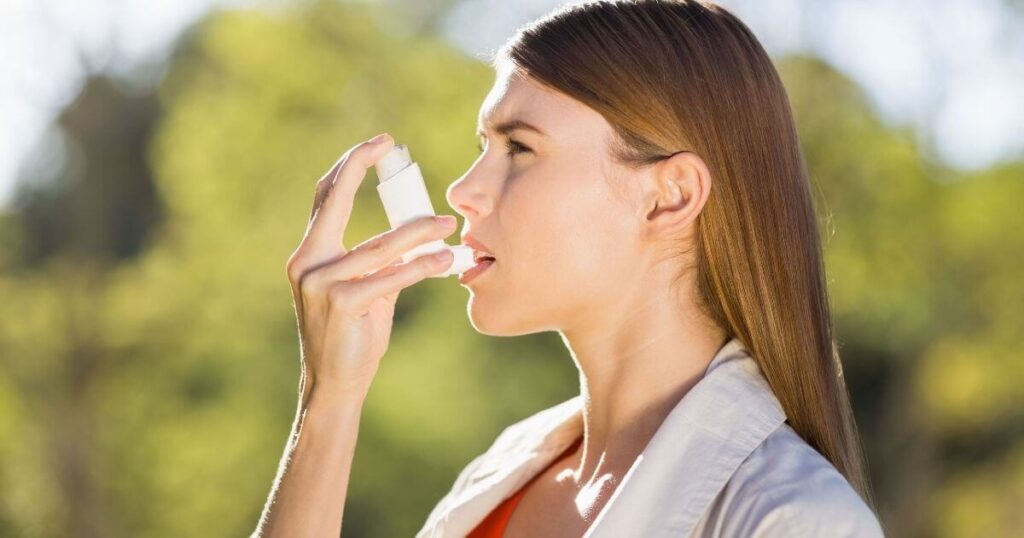 woman using inhaler