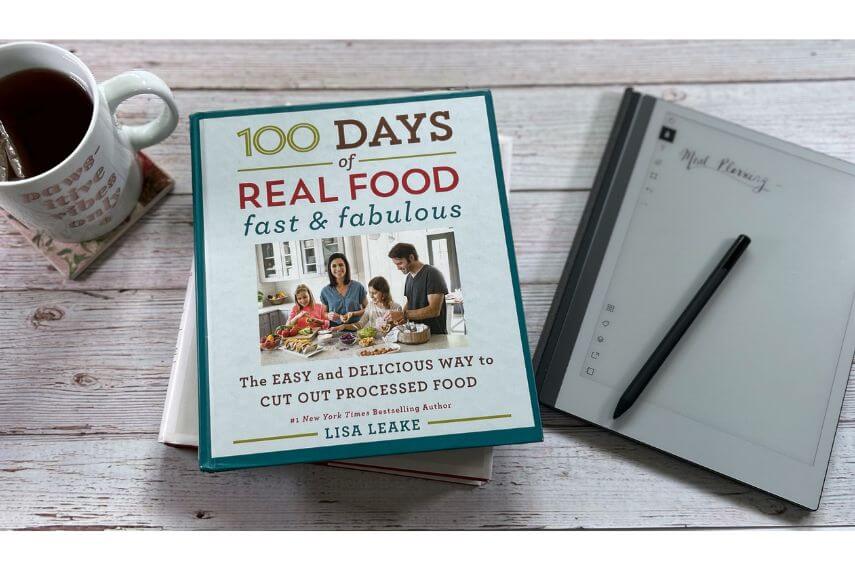 100 Days of Real Food fast & fabulous cookbook, digital notebook, digital pencil, and cup of tea