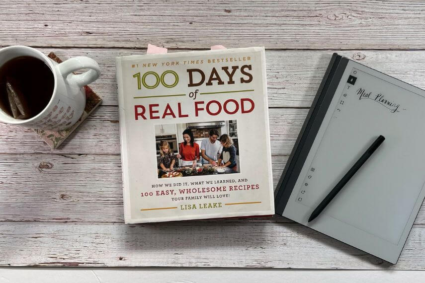 100 Days Of Real Food book, digital notebook, digital pencil, and cup of tea