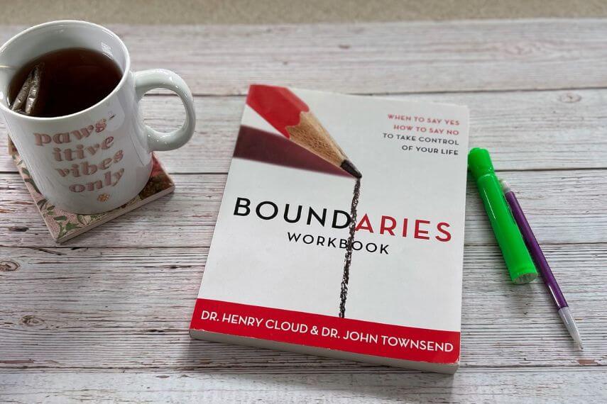 Boundaries Workbook, highlighter, pencil, and cup of tea