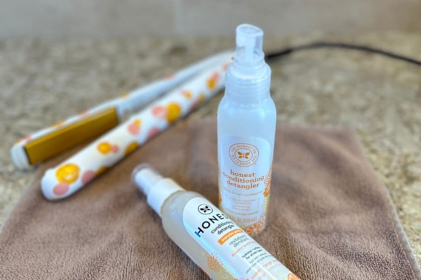 The Honest Company leave in spray conditioner bottles on towel
