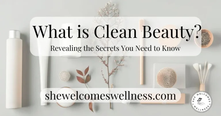 Flat lay of clean beauty products against a gray background. Text reads: "What is Clean Beauty? Revealing the Secrets You Need to Know" and "shewelcomeswellness.com".