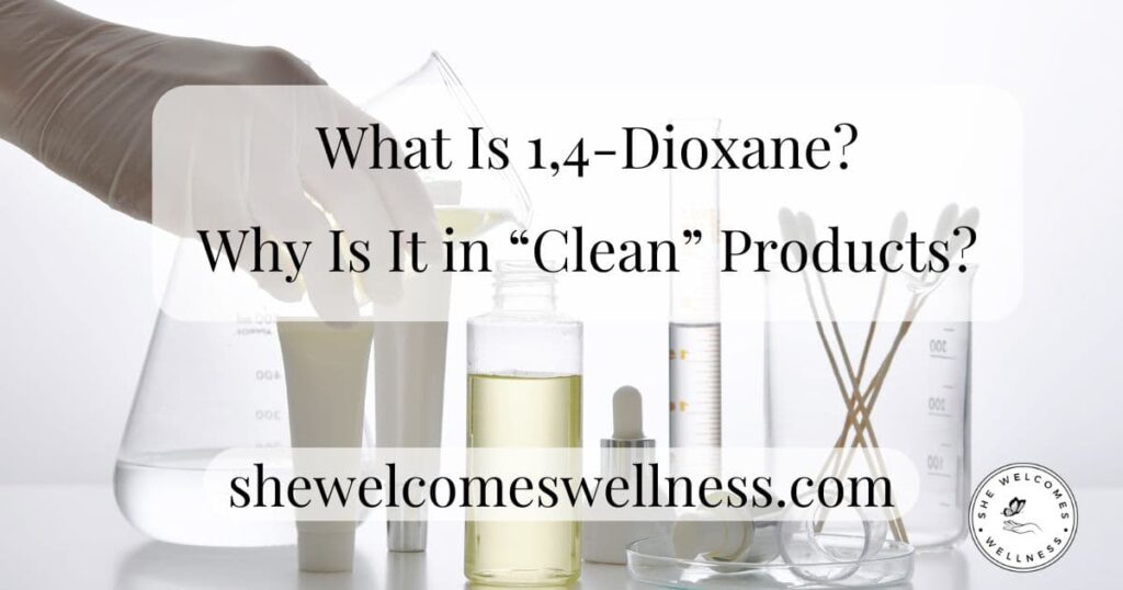 A gloved hand holds a beaker pouring liquid into a jar surrounded by lab equipment. Text overlay reads, "What Is 1,4-Dioxane? Why Is It in 'Clean' Products?" with "shewelcomeswellness.com" below. The tone is scientific and investigative.