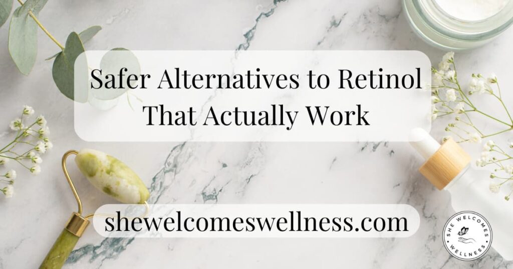 Marble surface with eucalyptus, a jade roller, dropper bottle, and small white flowers. Text overlay: "Safer Alternatives to Retinol That Actually Work."